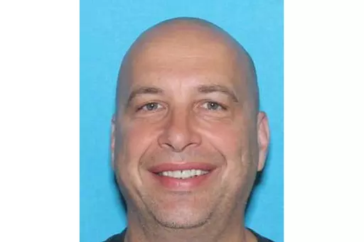 This drivers license image contained in the Statement of Facts supporting an arrest warrant, released by the Justice Department, shows Robert Sanford. Sanford, a retired firefighter who threw a fire extinguisher at police officers during the U.S. Capitol riot on Jan. 6, 2021, has been sentenced to more than four years in prison. (Justice Department via AP)