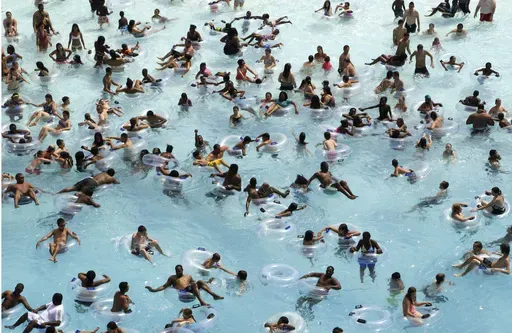 Swimmers try to stay cool in near 100 degree temperatures at Red Oaks Waterpark in Madison Heights, Mich., June 28, 2012. The Centers for Disease Control and Prevention says drowning is the leading cause of death for children ages 1 to 4. It's also the second leading cause of unintentional death for those ages 5 to 14. (AP Photo/Paul Sancya, File)