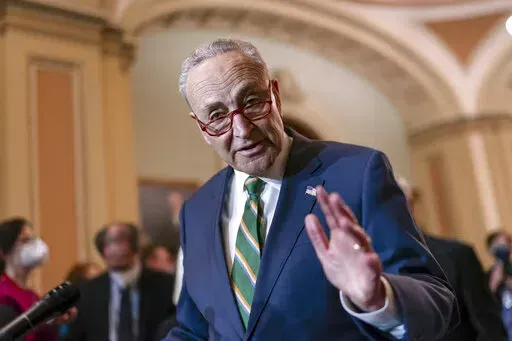 Senate Majority Leader Chuck Schumer, D-N.Y., meets with reporters following a Democratic Caucus meeting, at the Capitol in Washington, Tuesday, April 5, 2022. (AP Photo/J. Scott Applewhite)