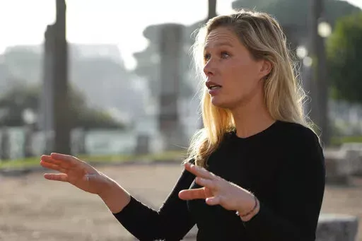 Laura Hart, campaign director of Safeguard Defenders is interviewed by the Associated Press in Rome, Thursday, Oct. 27, 2022. China has reportedly established dozens of “overseas police stations” in nations around the world that activists fear could be used to track and harass dissidents as part of Beijing’s crackdown on corruption. Spanish-based non-government group Safeguard Defenders published a report last month called “110 Overseas. Chinese Transnational Policing Gone Wild” that f