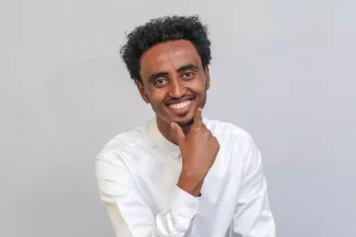 Freelance video journalist Amir Aman Kiyaro, who is accredited to The Associated Press and has been in detention since November 2021 without charges, poses for a photograph in Ethiopia on Oct. 17, 2021. Ethiopia is being urged on Monday, March 28, 2022, to uphold its international commitments to the freedoms of expression and the press as two lawmakers in the U.S. Congress joined press freedom advocates in calling for the immediate release of Kiyaro. (AP Photo, File)