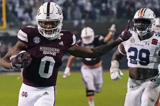 Then-Mississippi State wide receiver Rara Thomas (0) smiles after catching a pass for a touchdown against Auburn during the second half of an NCAA college football game in Starkville, Miss., Saturday, Nov. 5, 2022. Rodarius “Rara” Thomas, a wide receiver who recently transferred to Georgia from Mississippi State, was jailed early Monday, Jan. 23, 2023, in Athens, Ga., on a felony charge of false imprisonment and a misdemeanor count of family violence battery, according to Clarke County jail 