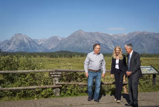 Federal Reserve Chair Jerome Powell, right, walks with with Federal Reserve Vice Chair Lael Brainard, center, and Federal Reserve Bank of New York president and CEO John Williams, left, at the central bank's annual symposium in Grand Teton National Park Friday, Aug. 26, 2022. in Moran, Wyo. (AP Photo/Amber Baesler)