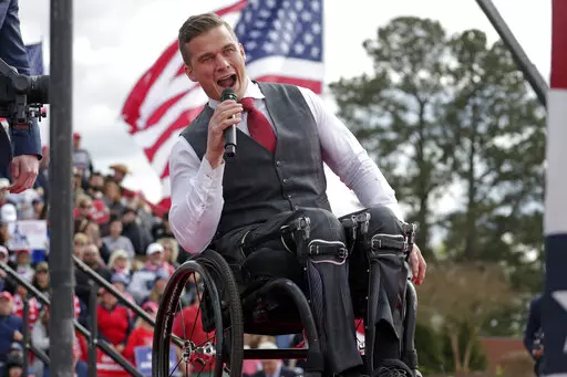Rep. Madison Cawthorn, R-N.C., speaks before former President Donald Trump takes the stage at a rally on April 9, 2022, in Selma, N.C. A series of unforced political and personal errors by Cawthorn has brought the forces of big-name Republicans and traditional enemies to bear on his reelection bid in North Carolina.(AP Photo/Chris Seward, File)