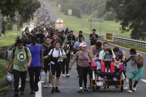 Migrants walk along the Huixtla highway in the state of Chiapas, Mexico, Oct. 22, 2024, hoping to reach the country's northern border and ultimately the United States. (AP Photo/Edgar H. Clemente, File)