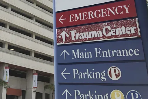 A sign is displayed outside a hospital in Miami, on July 9, 2020. (AP Photo/Wilfredo Lee, File)