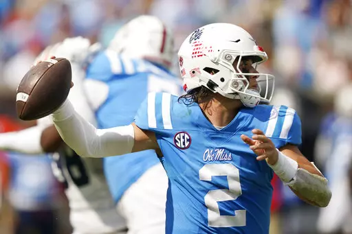 Mississippi quarterback Jaxson Dart (2) sets up to pass against Auburn during the second half of an NCAA college football game in Oxford, Miss., Saturday, Oct. 15, 2022. Mississippi won 48-34. (AP Photo/Rogelio V. Solis)