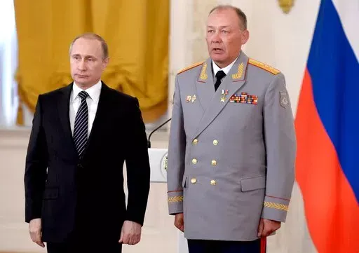 In this photo taken on March 17, 2016, Russian President Vladimir Putin, left, poses with Col. Gen. Alexander Dvornikov during an awarding ceremony in Moscow's Kremlin, Russia. Russia has appointed a new Ukraine war commander. A top U.S. official on Sunday, April 10, 2022 said Russia named Gen. Dvornikov as commander of an armed campaign that Russian authorities still refer to as a “special military operation." (Alexei Nikolsky/Sputnik, Kremlin Pool Photo via AP)