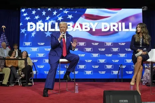 Republican presidential nominee former President Donald Trump speaks at a campaign town hall at the Greater Philadelphia Expo Center & Fairgrounds, Oct. 14, 2024, in Oaks, Pa., as moderator South Dakota Gov. Kristi Noem listens. (AP Photo/Alex Brandon, File)