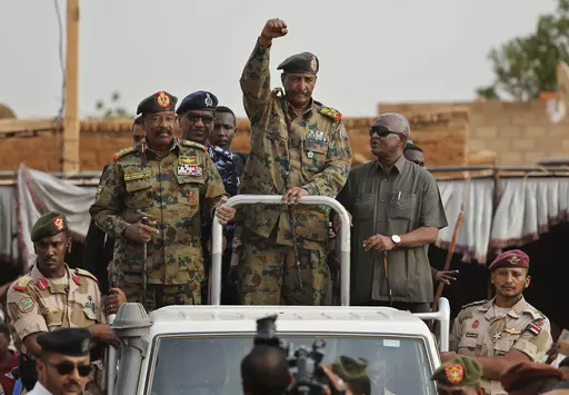 Sudanese Gen. Abdel-Fattah Burhan, head of the military council, waves to his supporters upon his arrival to attend a military-backed rally, in Omdurman district, west of Khartoum, Sudan, Saturday, June 29, 2019.(AP Photo/Hussein Malla, File)