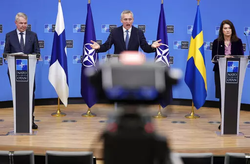 NATO Secretary General Jens Stoltenberg, center, participates in a media conference with Finland's Foreign Minister Pekka Haavisto, left, and Sweden's Foreign Minister Ann Linde, right, at NATO headquarters in Brussels, Jan. 24, 2022. The question of whether to join NATO is coming to a head in Finland and Sweden, where Russia's invasion of Ukraine has shattered the long-held belief that remaining outside the military alliance was the best way to avoid trouble with their giant neighbor. (AP Photo