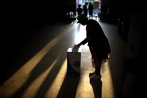 A woman casts her ballot at a polling station, during general elections in Eshowe, South Africa, Wednesday May 29, 2024. South Africans are voting in an election seen as their country's most important in 30 years, and one that could put them in unknown territory in the short history of their democracy, the three-decade dominance of the African National Congress party being the target of a new generation of discontent in a country of 62 million people — half of whom are estimated to be living i