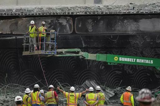 Crews continue to work the scene of a collapsed elevated section of Interstate 95, in Philadelphia, Wednesday, June 14, 2023. (AP Photo/Matt Rourke)