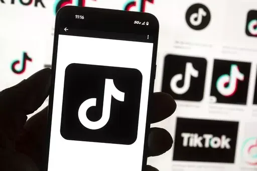 The TikTok logo is seen on a cell phone on Oct. 14, 2022, in Boston. On Thursday, Jan. 12, 2023, Wisconsin became the latest state to ban the use of TikTok on state phones and other devices, a move that comes amid a push for a federal ban and after nearly half of the states nationwide have blocked the popular app. (AP Photo/Michael Dwyer, File)