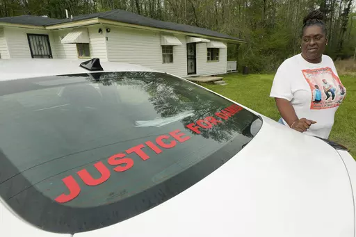 Monica Lee stands outside her eldest son's house in Braxton, Miss., March 21, 2023, as she talks about her youngest son, Damien Cameron. The 29-year-old Black man, with a history of mental illness, died in July 2021 after being arrested by two Rankin County sheriff's deputies. A civil suit can continue against a former Mississippi deputy who pleaded guilty on Aug. 3 to torturing and shooting a Black man in the mouth, with the suit alleging the former deputy is also responsible for the death of a