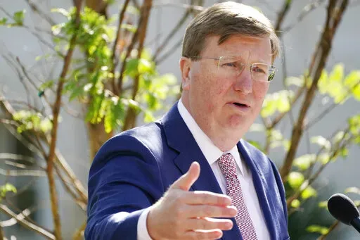 Mississippi Gov. Tate Reeves speaks at a bill signing in the Governor's Mansion garden in Jackson, Miss., Tuesday, April 19, 2022. (AP Photo/Rogelio V. Solis)