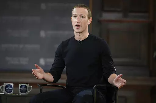 Facebook CEO Mark Zuckerberg speaks at Georgetown University in Washington, Thursday, Oct. 17, 2019. Facebook parent Meta is laying off 11,000 people, about 13% of its workforce, as it contends with faltering revenue and broader tech industry woes, Zuckerberg said in a letter to employees Wednesday. (AP Photo/Nick Wass, File)