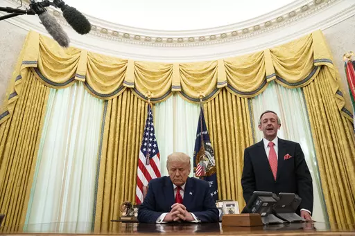 Pastor Robert Jeffress and President Donald Trump pray after Trump signed a full pardon for Alice Johnson in the Oval Office of the White House, Friday, Aug. 28, 2020, in Washington. Jeffress, pastor of an evangelical megachurch in Dallas, has been a staunch supporter of Trump since his first campaign for president. “Conservative Christians continue to overwhelmingly support Donald Trump because of his biblical policies, not his personal piety,” Jeffress told The Associated Press via email. 