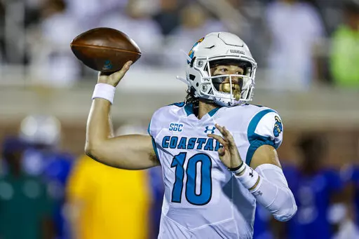Coastal Carolina quarterback Grayson McCall looks to pass against Kansas during the first half of an NCAA college football game in Conway, S.C., Friday, Sept. 10, 2021. The Sun Belt Conference has done plenty to past few seasons to catch college football's attention. Those in charge believe the league took additional steps this offseason to keep that going. (AP Photo/Nell Redmond, File)