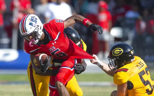 Jackson State safety John Huggings (6) pushes through Grambling State defense during the second half of an NCAA college football game in Jackson, Miss., Saturday, Sept. 17, 2022. (Barbara Gauntt/The Clarion-Ledger via AP)