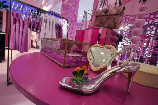 Barbie-themed merchandise is displayed in a special section at Bloomingdale's, in New York, Thursday, July 20, 2023. According to the fashion company LYST, the "Barbiecore" trend began after pictures of a pink-clad Margot Robbie surfaced online in June 2022, a year before the actor's "Barbie" movie came out and toy maker Mattel launched its own marketing blitz to promote the color. (AP Photo/Richard Drew, File)
