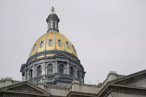 The gold dome of the Colorado State Capitol on March 23, 2023, in Denver. In Colorado, House lawmakers approved a measure Wednesday, April 12, that would lower the maximum interest rate for medical debt to 3%, require greater transparency in costs of treatment and prohibit debt collection during an appeals process. (AP Photo/David Zalubowski, File)