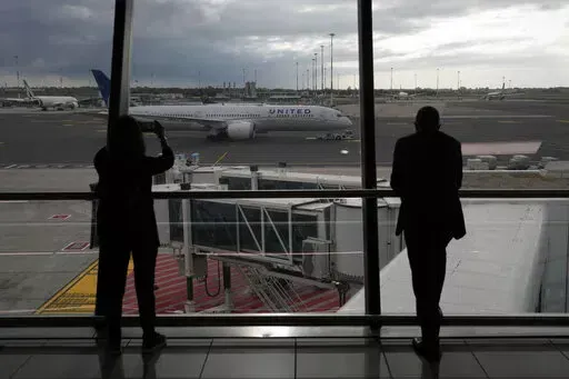 People look at a United Airlines flight leaving for Newark, NJ, at Fiumicino's Leonardo Da Vinci airport, near Rome, Monday, Nov. 8, 2021.    Experience may be the best teacher when traveling. (AP Photo/Alessandra Tarantino, File)