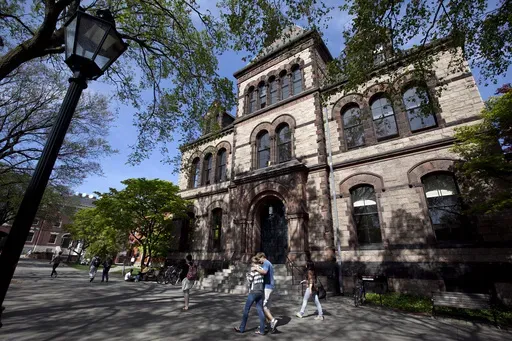 Passersby walk past Sayles Hall on Brown University's campus in Providence, R.I., May 7, 2012. (AP Photo/Steven Senne, File)