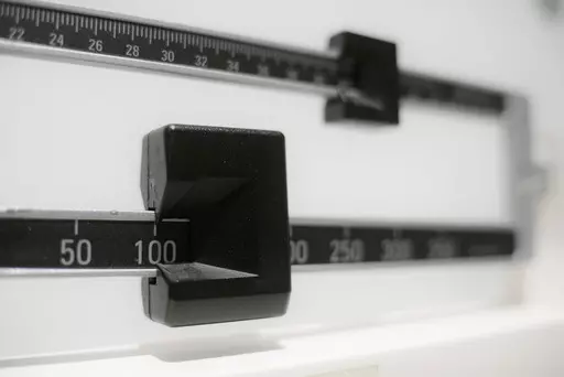 This Tuesday, April 3, 2018 file photo shows a closeup of a beam scale in New York. High-dose oral versions of the medication in the weight-loss drug Wegovy may work as well as injections at paring pounds and improving health, including hard-to-treat people with diabetes, according to research released Sunday, June 25, 2023. (AP Photo/Patrick Sison, File)