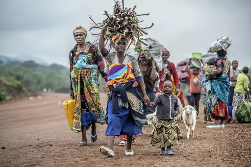 Residents flee fighting between M23 rebels and Congolese forces near Kibumba, some 20 kms ( 12 miles) North of Goma, Democratic Republic of Congo, on Oct. 29, 2022. Eastern Congo has been beset by conflict for years, with M23 one of more than 100 armed groups vying for a foothold in the mineral-rich area near the border with Rwanda (AP Photo/Moses Sawasawa, File)