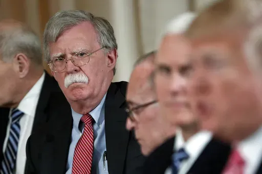 National security adviser John Bolton, left, listens to President Donald Trump, far right, speak during a working lunch with Japanese Prime Minister Shinzo Abe at Trump' s private Mar-a-Lago club, April 18, 2018 in Palm Beach, Fla. (AP Photo/Pablo Martinez Monsivais)