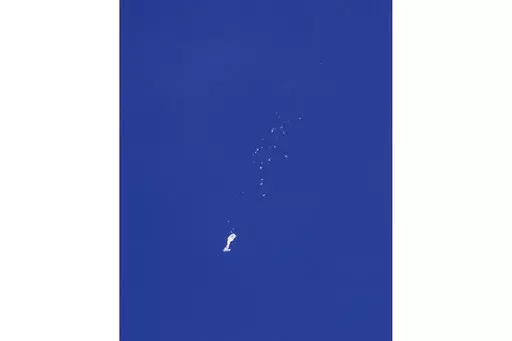 The remnants of a large balloon descend after it was struck by a missile from an F-22 fighter jet over the Atlantic Ocean, just off the coast of South Carolina near Myrtle Beach, Feb. 4, 2023. China's ceremonial parliament has accused American lawmakers of trampling on the sovereignty of other nations after the U.S. passed a measure condemning a suspected Chinese spy balloon's intrusion into U.S. airspace. (Chad Fish via AP, File)