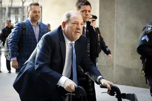 Harvey Weinstein arrives at a Manhattan courthouse as jury deliberations continue in his rape trial in New York, on Feb. 24, 2020. On Monday, Dec. 19, 2022, Weinstein was found guilty of rape at a Los Angeles trial in another #MeToo moment of reckoning, five years after he became a magnet for the movement. (AP Photo/John Minchillo, File)