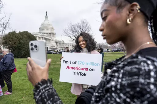Devotees of TikTok, Mona Swain, center, and her sister, Rachel Swain, right, both of Atlanta, monitor voting at the Capitol in Washington, as the House passed a bill that would lead to a nationwide ban of the popular video app if its China-based owner doesn't sell, March 13, 2024. If some U.S. lawmakers have their way, the United States and China could end up with something in common: TikTok might not be available in either country. (AP Photo/J. Scott Applewhite, File)