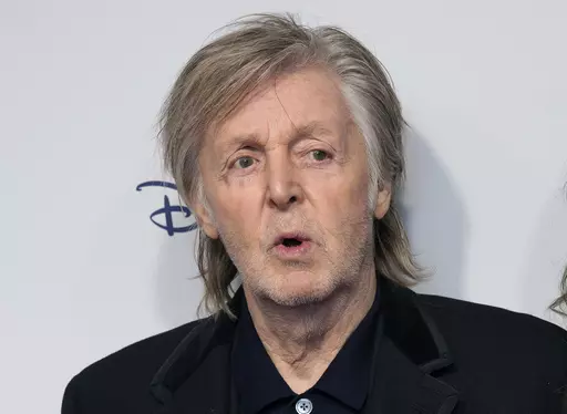 Paul McCartney and Nancy Shevell pose for photographers upon arrival for the premiere of the film 'If These Walls Could Sing' in London, Monday, Dec. 12, 2022. Artificial intelligence has been used to extract John Lennon's voice from an old demo to create “the last Beatles record,” Paul McCartney said Tuesday, June 13, 2023. McCartney, 80, told the BBC that the technology was used to separate the Beatles' voices from background sounds during the making of director Peter Jackson's 2021 docume