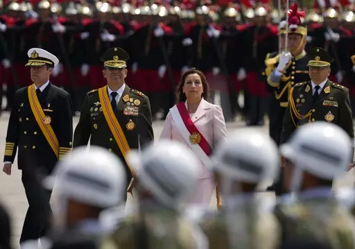 Peru's new President Dina Boluarte attends a ceremony marking Army Day in Lima, Peru, Friday, Dec. 9, 2022. Peru's Congress voted to remove President Pedro Castillo from office Wednesday and replace him with the vice president, Boluarte, shortly after Castillo tried to dissolve the legislature ahead of a scheduled vote to remove him. (AP Photo/Martin Mejia)