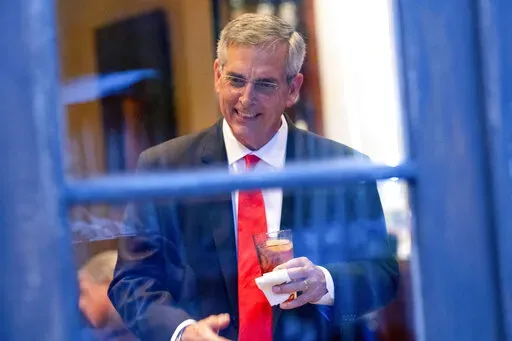 Georgia Secretary of State Brad Raffensperger talks with supporters during an election night party on May 24, 2022, at a restaurant in Peachtree Corners, Ga. (AP Photo/Ben Gray, File)