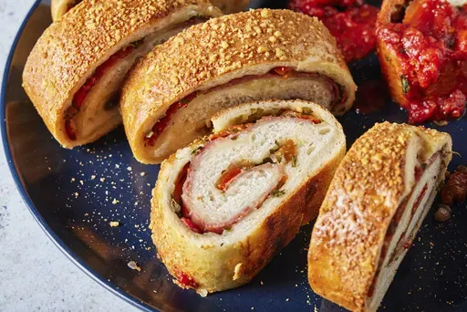 This image released by Milk Street shows a recipe for salami and cheese stromboli . (Milk Street via AP)