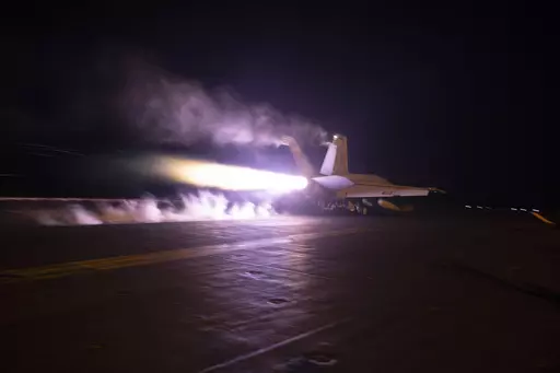 This image provided by the U.S. Navy shows an aircraft launching from USS Dwight D. Eisenhower (CVN 69) during flight operations in the Red Sea, Jan. 22, 2024. The United States and Britain struck 36 Houthi sites in Yemen on Saturday, Feb. 3, in a second wave of assaults meant to further disable Iran-backed groups in the region. (Kaitlin Watt/U.S. Navy via AP)