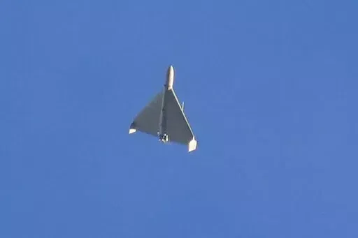 A drone is seen in the sky seconds before it fired on buildings in Kyiv, Ukraine, Monday, Oct. 17, 2022. (AP Photo/Efrem Lukatsky)