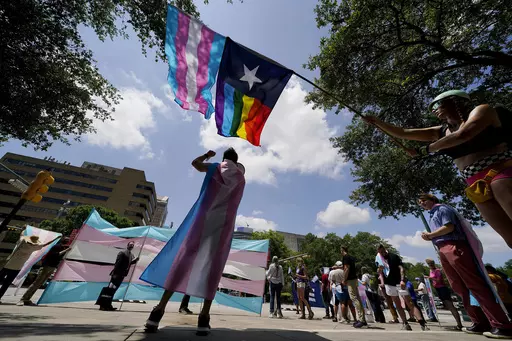 Demonstrators gather on the steps to the Texas Capitol to speak against transgender-related legislation bills being considered in the Texas Senate and House, May 20, 2021, in Austin, Texas. The Texas Supreme Court will allow the new state law banning gender-affirming care for minors to take effect on Friday, Sept. 1, 2023, setting up Texas to be the most populous state with such restrictions on transgender children. (AP Photo/Eric Gay, File)
