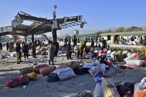 Security officials examine the site of a bomb explosion at railway station in Quetta, southwestern Pakistan, Saturday, Nov. 9, 2024. (AP Photo/Arshad Butt)