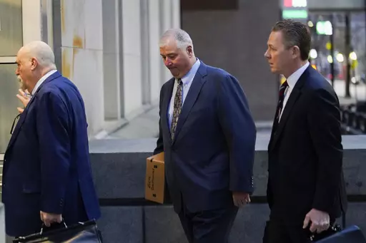 Former Ohio House Speaker Larry Householder, center, walks into Potter Stewart U.S. Courthouse with his attorneys, Mark Marein, left, and Steven Bradley, right, before jury selection in his federal trial, Jan. 20, 2023, in Cincinnati, Ohio. Householder and former Ohio Republican Party Chair Matt Borges were convicted Thursday, March 9, 2023, in a $60 million bribery scheme that federal prosecutors have called the largest corruption case in state history. (AP Photo/Joshua A. Bickel, File)