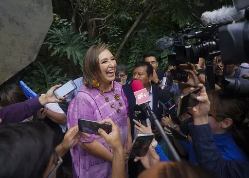 Senator Xochitl Galvez, an opposition presidential hopeful, speaks to the press after registering her name as a candidate in Mexico City, July 4, 2023. The street saleswoman turned tech entrepreneur is shaking up the contest to succeed Mexico's popular president, offering an alternative to Mexican President Andrés Manuel López Obrador’s dominant party. (AP Photo/Fernando Llano, File)