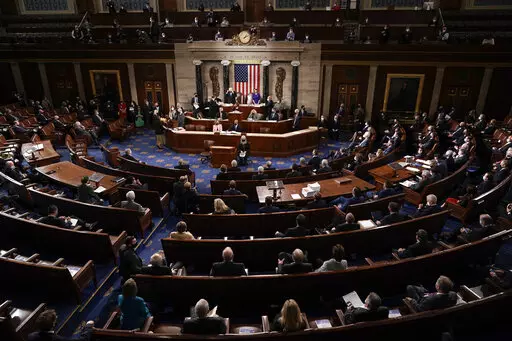 In this Jan. 6, 2021, photo, the Republican side, right, in the House chamber is seen as Speaker of the House Nancy Pelosi, D-Calif., and Vice President Mike Pence officiate as a joint session of the House and Senate convenes to count the Electoral College votes cast in November's election, at the Capitol in Washington. State attorneys general and the House committee investigating the Jan. 6 attack on the Capitol are digging deeper into the role that fake slates of electors played in the despera