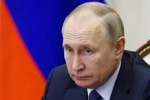 Russian President Vladimir Putin attends the annual meeting of the Presidential Council for Civil Society and Human Rights via videoconference in Moscow, Russia, Wednesday, Dec. 7, 2022. (Mikhail Metzel, Sputnik, Kremlin Pool Photo via AP)