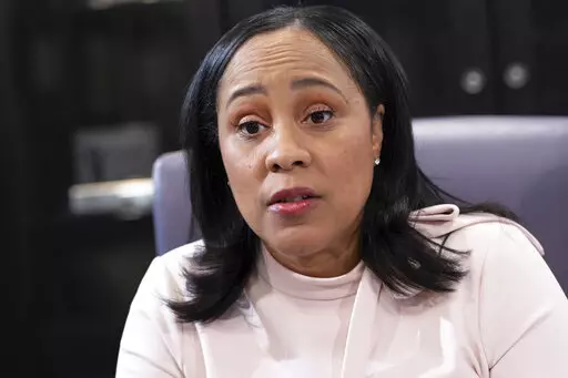 Fulton County Georgia District Attorney Fani Willis is photographed in her office in Atlanta, on Jan. 4, 2022. Willis is investigating whether Trump and others illegally tried to influence the 2020 election in Georgia. As part of the probe, Willis filed court documents on Friday, Sept. 2, 2022, seeking testimony from Willie Lewis Floyd, a director of Black Voices for Trump, a group aimed at increasing the former president's support among Black voters. (AP Photo/Ben Gray, File)