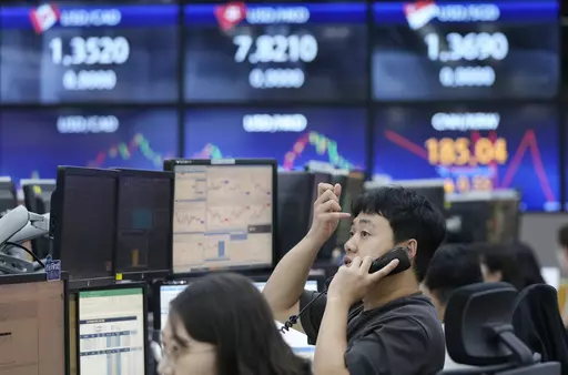A currency trader talks on the phone at the foreign exchange dealing room of the KEB Hana Bank headquarters in Seoul, South Korea, Wednesday, Sept. 27, 2023. Shares in Asia were mostly lower on Wednesday after Wall Street’s ugly September got even worse, with benchmarks dropping back to where they were in June.(AP Photo/Ahn Young-joon)