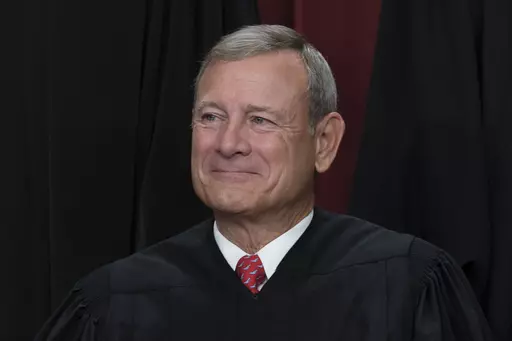 Chief Justice of the United States John Roberts joins other members of the Supreme Court as they pose for a new group portrait, at the Supreme Court building in Washington, Friday, Oct. 7, 2022. (AP Photo/J. Scott Applewhite, File)