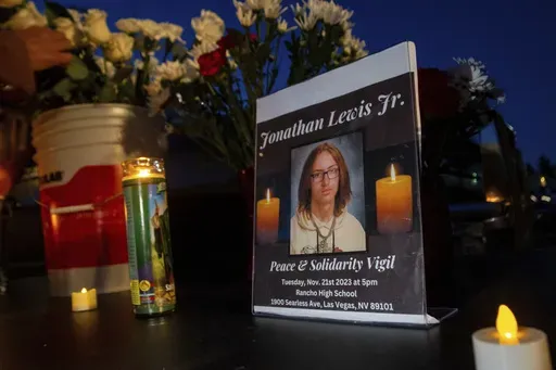 A memorial for Jonathan Lewis Jr. is set up in an alleyway near Rancho High School in eastern Las Vegas, Nov. 21, 2023. Four high school students have agreed to plead guilty in juvenile court to voluntary manslaughter in the fatal beating of Lewis in a plea deal that will keep them from being tried as adults, lawyers said during a hearing Thursday, Aug. 1, 2024. (AP Photo/Ty O'Neil, File)